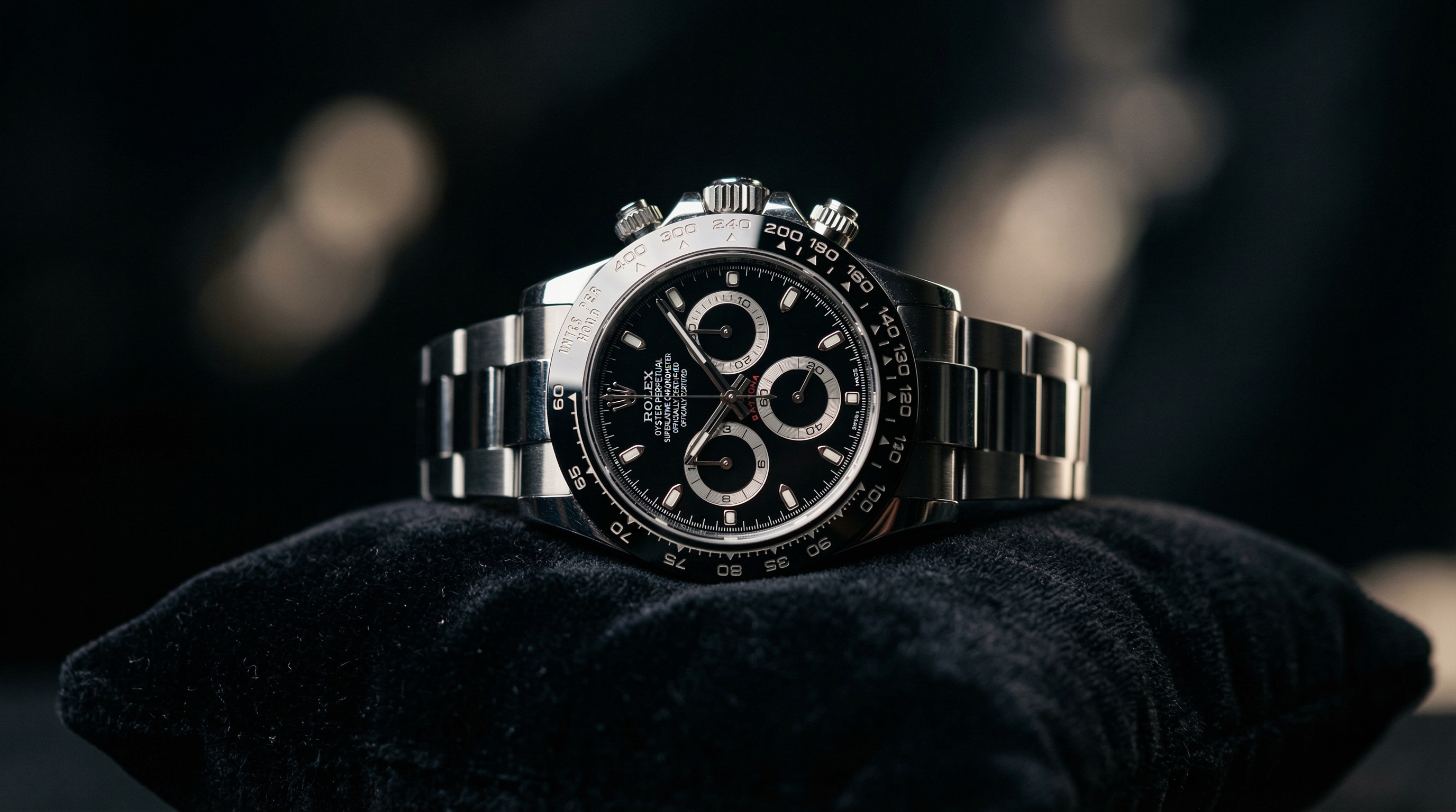 A luxury wristwatch on a velvet cushion